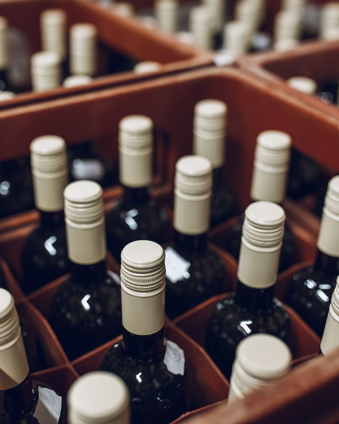 Stack of wine bottles in cellar